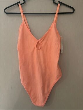 Colsie NWT xs Ribbed Peachy Pink One-Piece Bodysuit keyhole tank